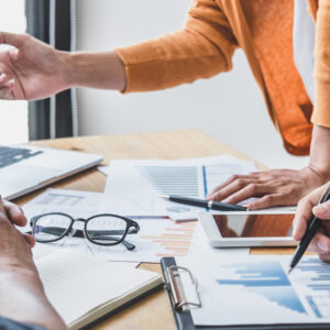 Business team collaboration discussing working analyzing with financial data and marketing growth report graph in team, presentation and brainstorming to strategy planning making profit of company.