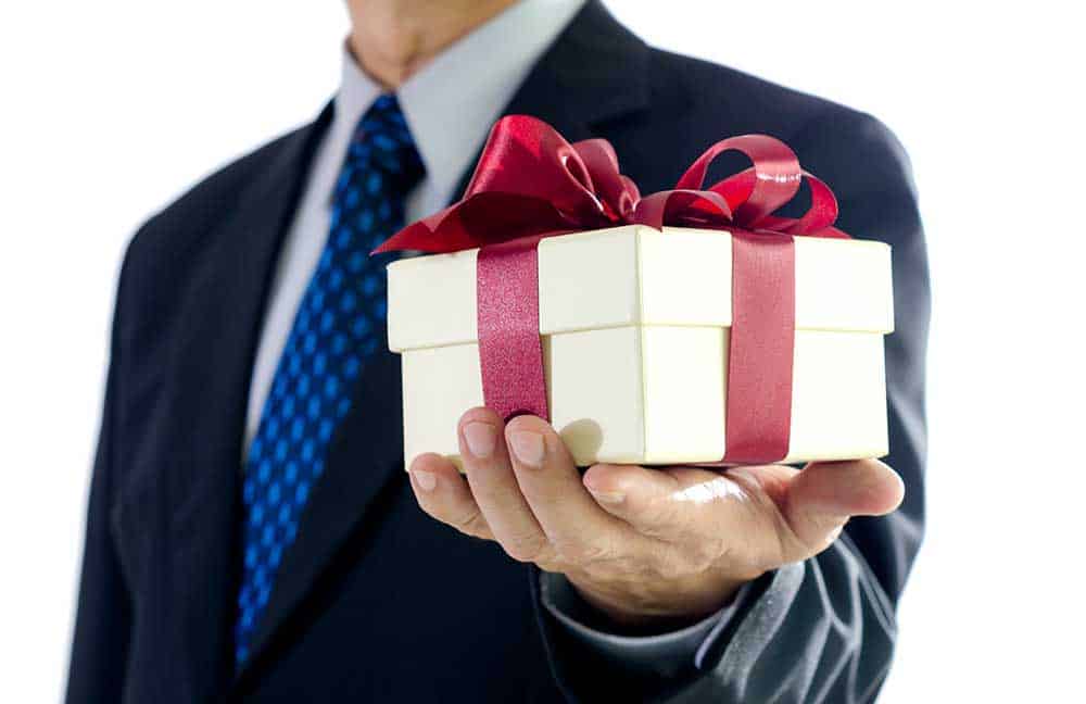 businessperson giving a gift