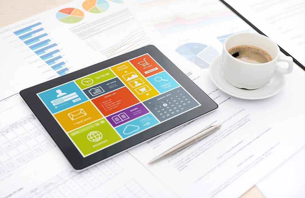 Data on a tablet with coffee