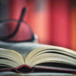 open book with glasses
