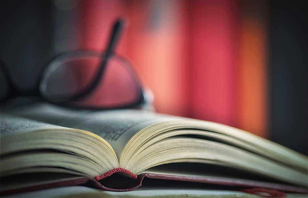 open book with glasses